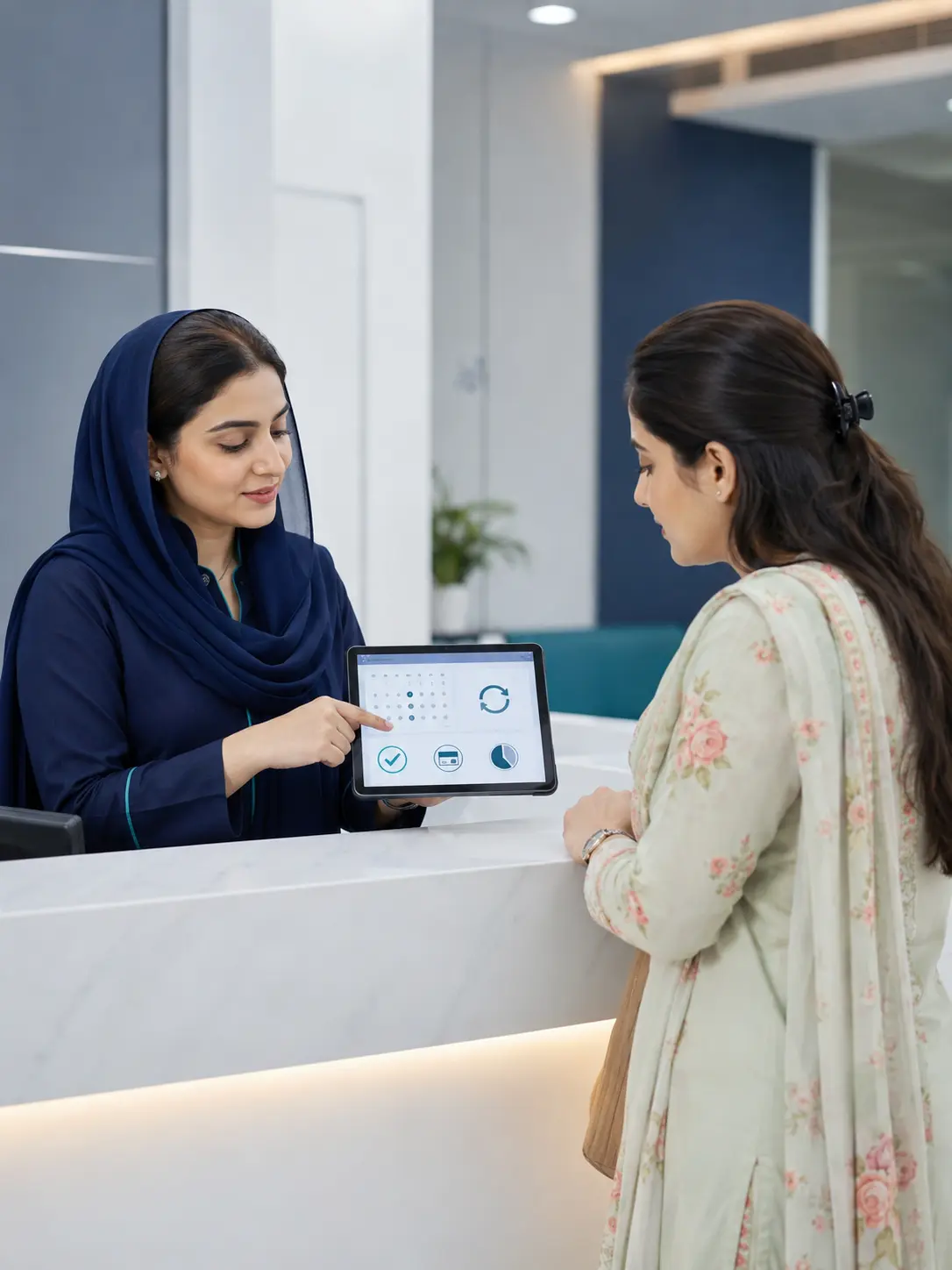 Dental receptionist explaining appointment and payment arrangements to a patient